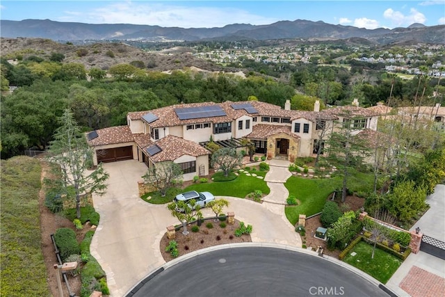 birds eye view of property with a mountain view