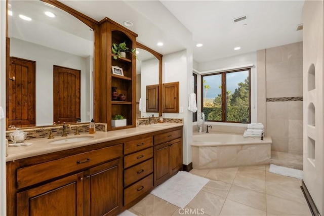 bathroom featuring vanity, decorative backsplash, tile patterned floors, and shower with separate bathtub