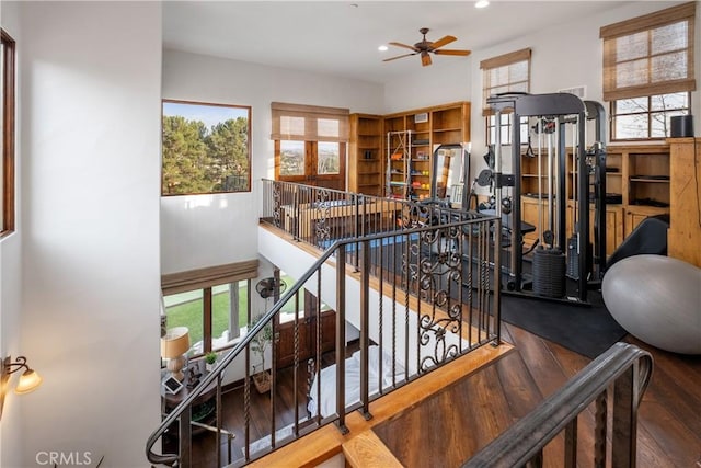 interior space with hardwood / wood-style flooring and ceiling fan