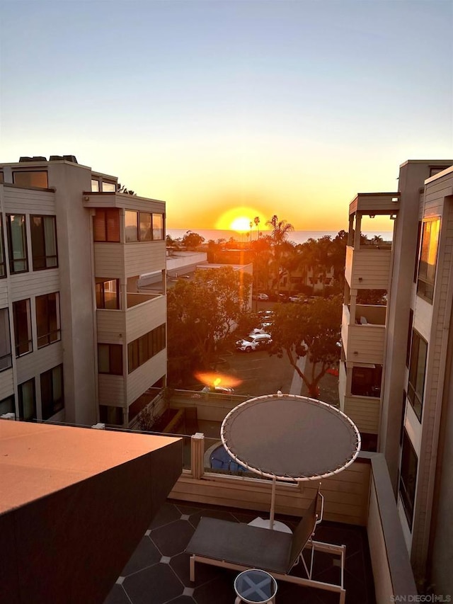 view of balcony at dusk