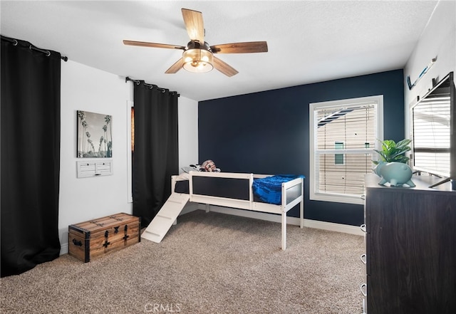 carpeted bedroom with ceiling fan