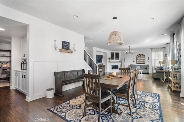 dining room featuring a chandelier and dark hardwood / wood-style flooring