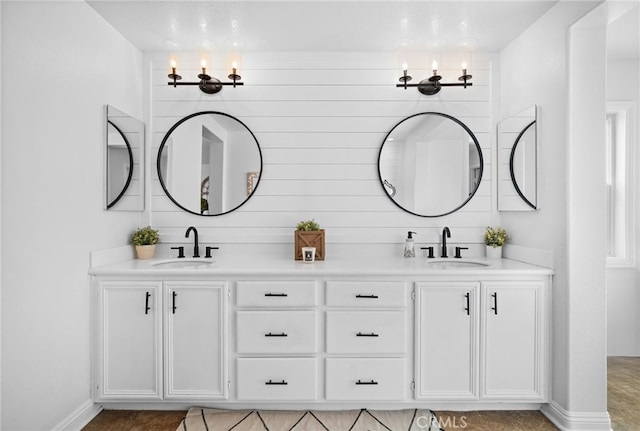 bathroom with vanity and a notable chandelier