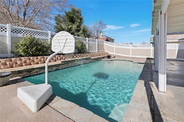 view of swimming pool with pool water feature