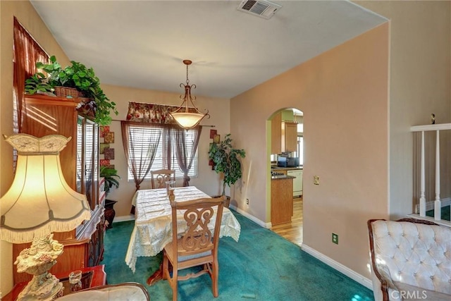 view of carpeted dining area