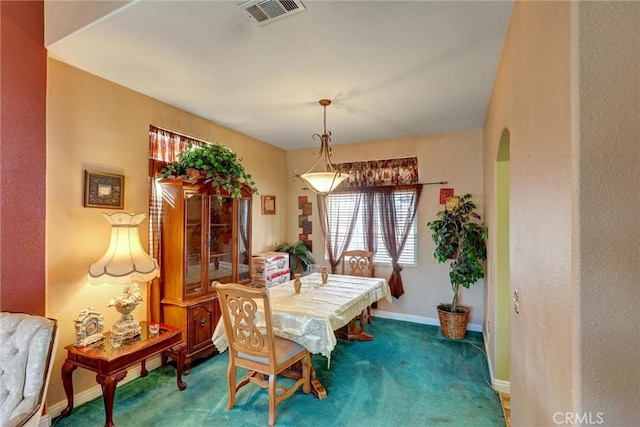 view of carpeted dining area