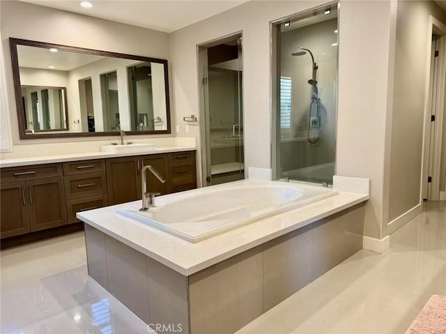 bathroom with separate shower and tub, tile patterned floors, and vanity