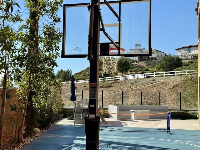 view of basketball court with tennis court