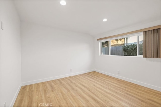 spare room with light hardwood / wood-style floors