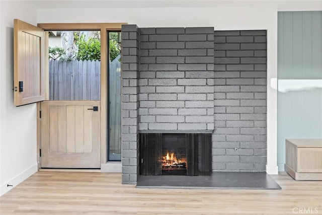 details featuring a fireplace and hardwood / wood-style flooring