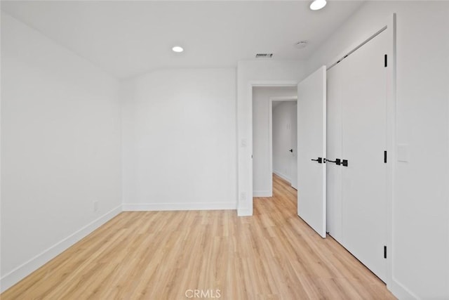 unfurnished room with light wood-type flooring