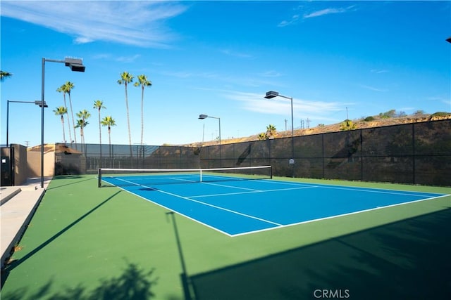 view of tennis court with basketball court