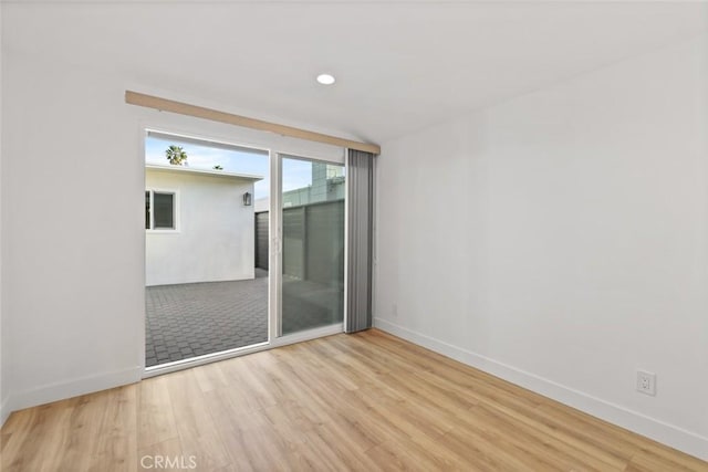 empty room with light hardwood / wood-style floors