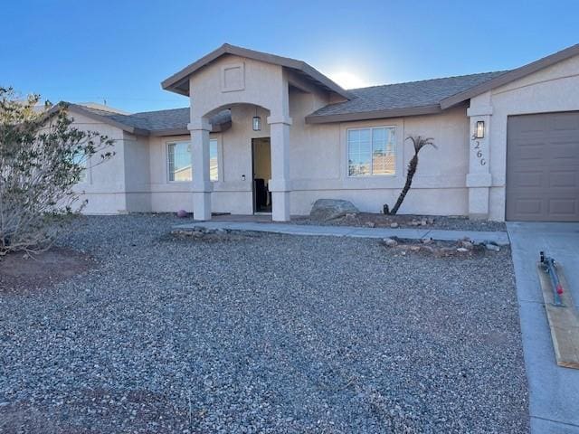 view of front of property with a garage