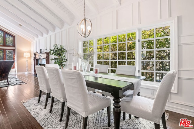 dining room featuring an inviting chandelier, dark hardwood / wood-style floors, beam ceiling, and wooden ceiling