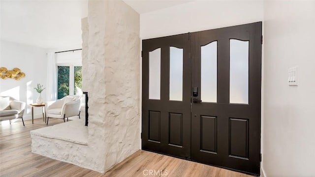 foyer entrance with light wood-type flooring