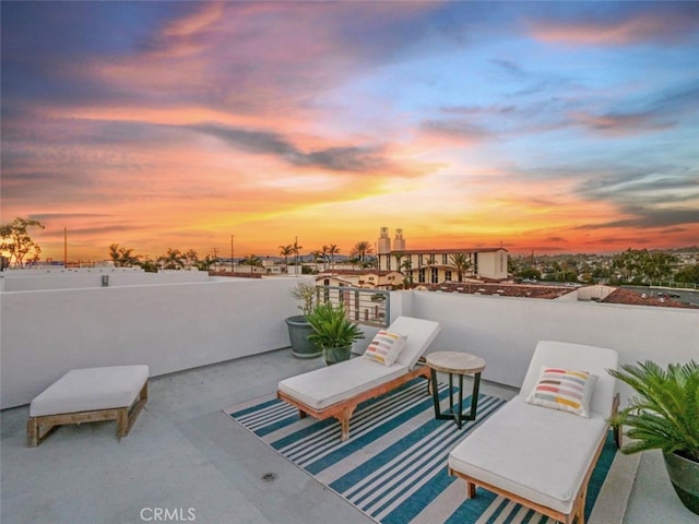 view of patio terrace at dusk