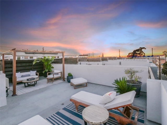 patio terrace at dusk with an outdoor living space