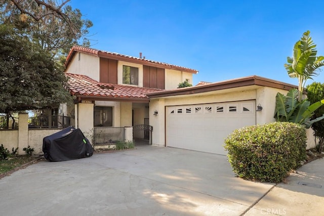 mediterranean / spanish home featuring a garage