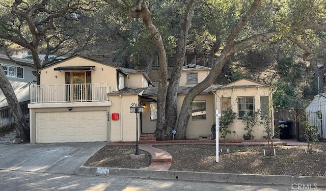 view of front of house with a balcony and a garage