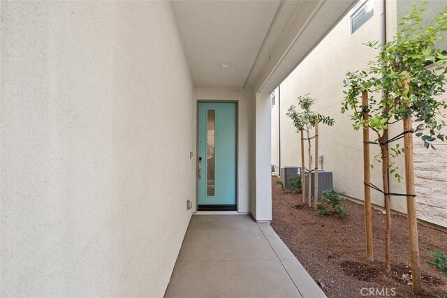 property entrance with central AC unit