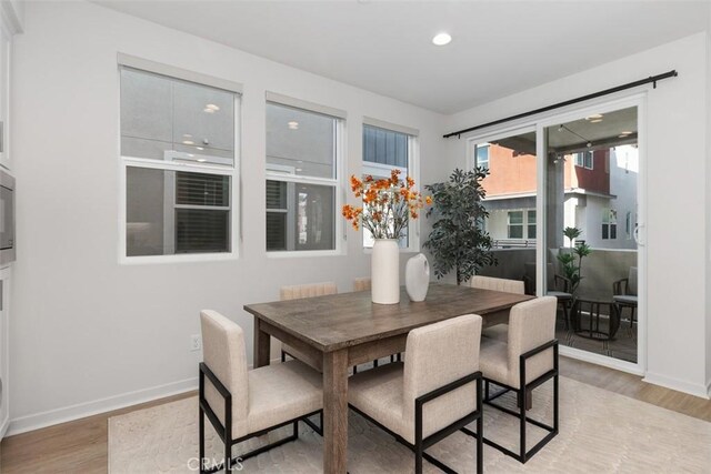 dining space featuring hardwood / wood-style floors