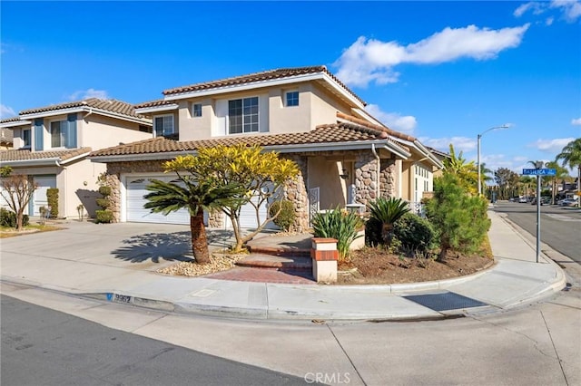 mediterranean / spanish house featuring a garage