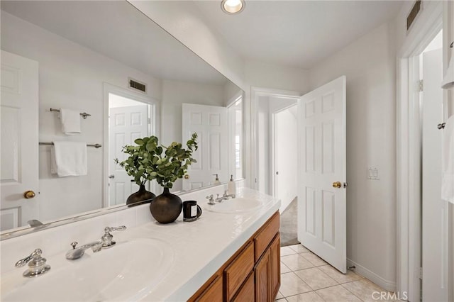 bathroom with vanity and tile patterned flooring