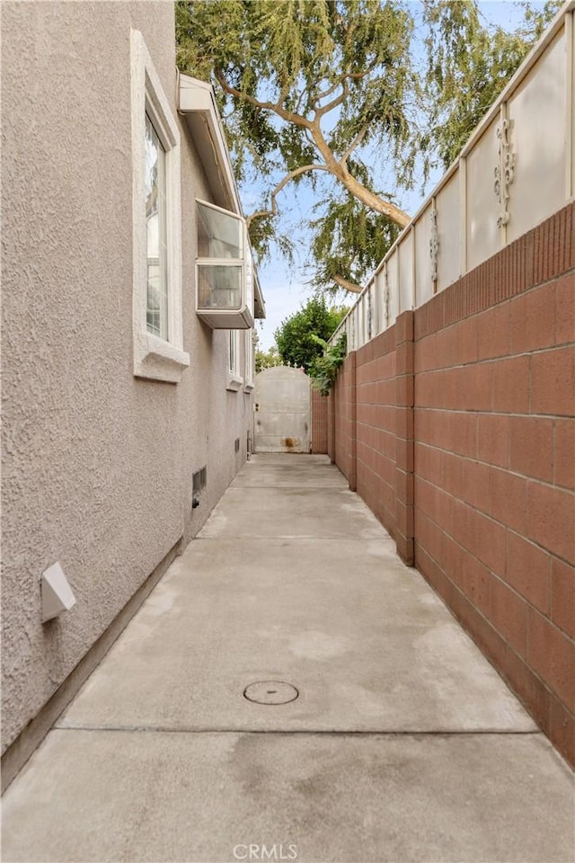 view of side of property featuring a patio area