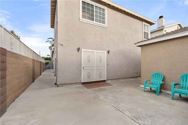 rear view of house featuring a patio