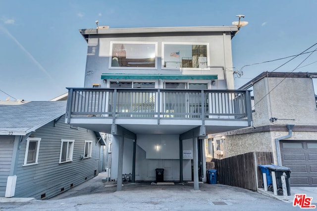 rear view of house with a balcony