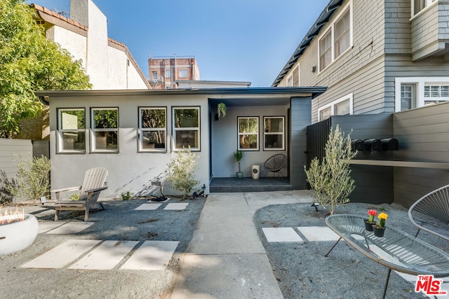 rear view of property featuring a patio