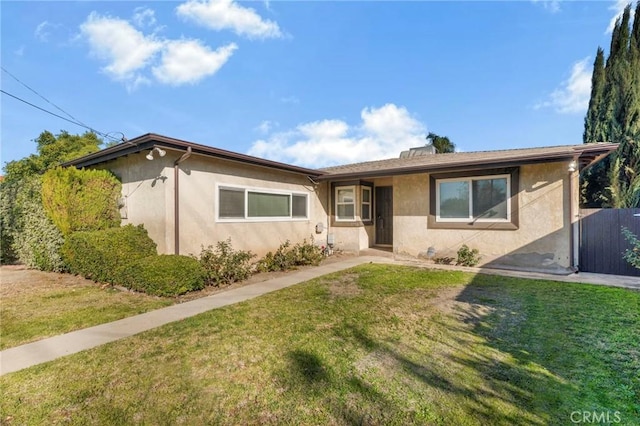 ranch-style house featuring a front yard