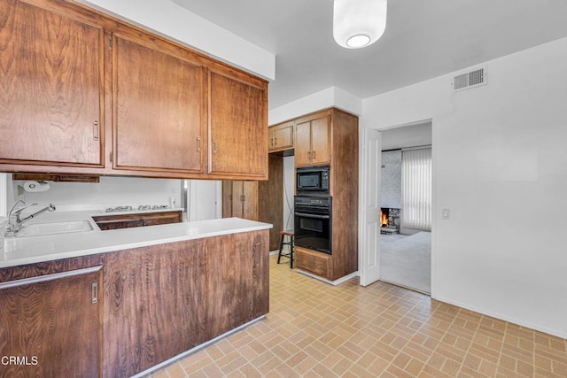 kitchen featuring sink and black appliances