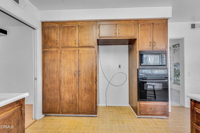 kitchen with built in microwave and oven