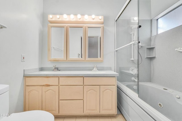 full bathroom featuring toilet, tile patterned flooring, and vanity