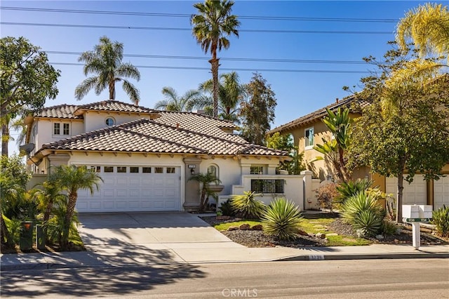 mediterranean / spanish-style house featuring a garage