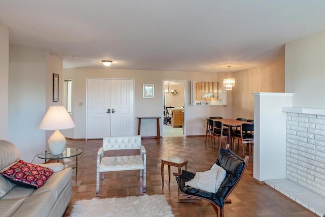 living room with a chandelier and parquet floors