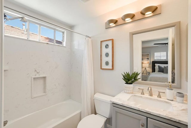 full bathroom featuring ceiling fan, toilet, vanity, and shower / bath combination with curtain