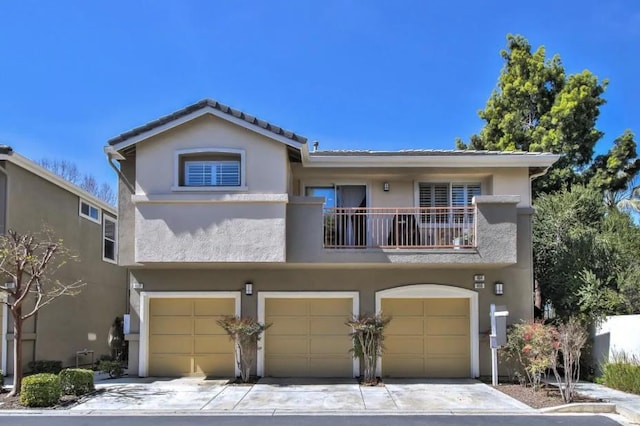 view of front of house with a balcony and a garage