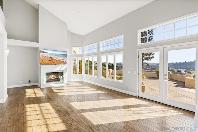 unfurnished sunroom with french doors