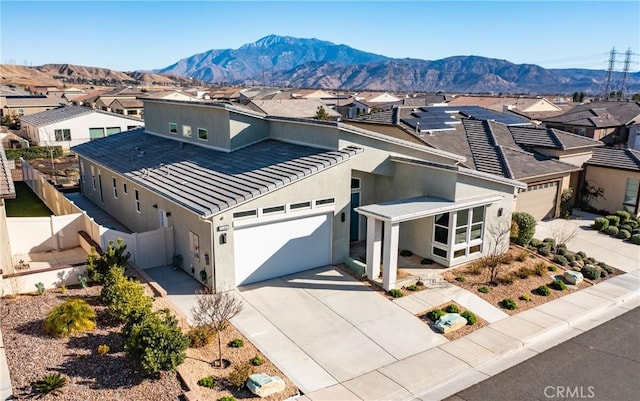 birds eye view of property featuring a mountain view