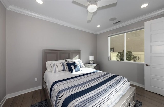 bedroom with ceiling fan, dark wood-type flooring, and ornamental molding