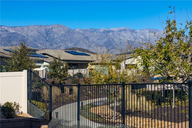 view of gate with a mountain view