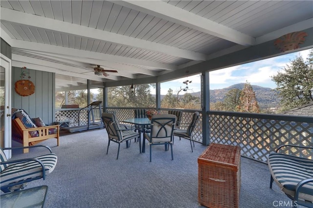 view of patio / terrace with a mountain view and ceiling fan