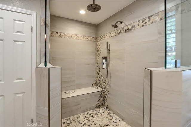 bathroom featuring tiled shower