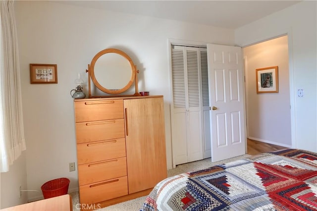 bedroom with a closet and carpet