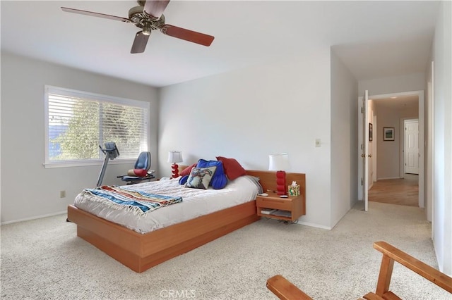 bedroom with ceiling fan and light colored carpet