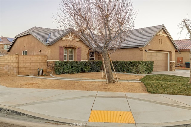 view of front of property with a garage