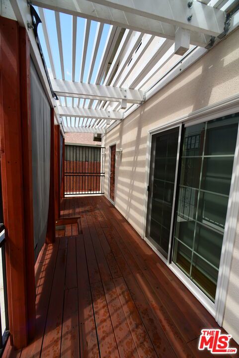 wooden terrace featuring a pergola